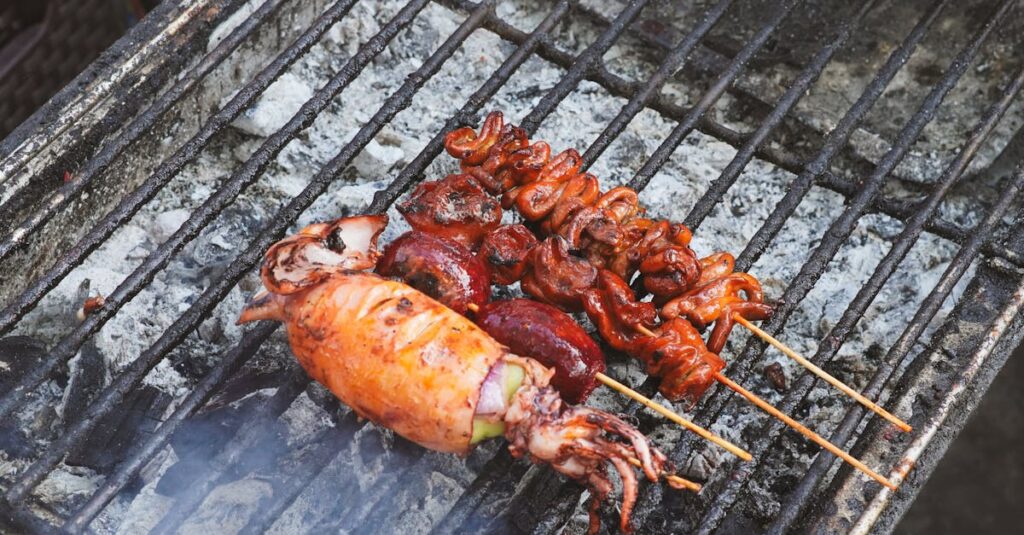 Close-up of various seafood skewers grilling on a traditional charcoal barbecue.